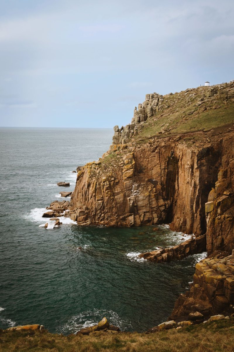 Rugged coastal cliffs above the sea in Cornwall, England